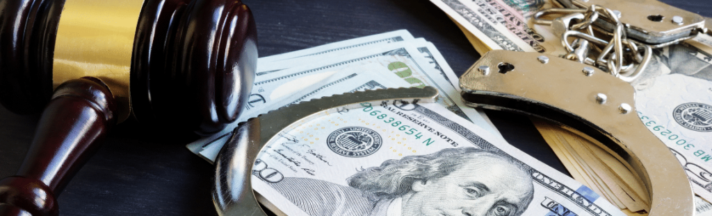 gavel cash and handcuffs on table