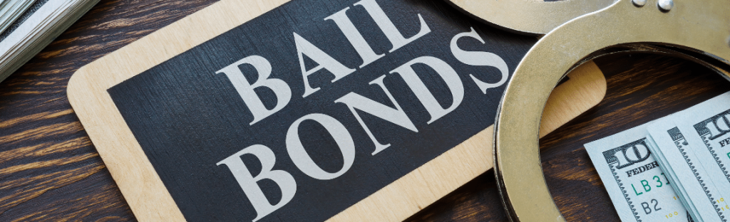 wood board bail bonds with handcuffs and money on top