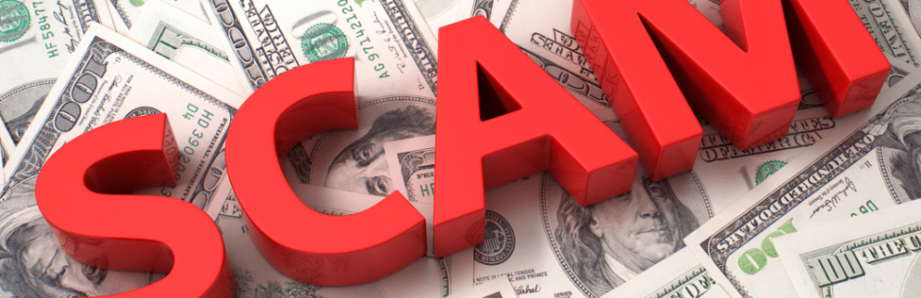 red block scam letters on 100 dollar bills