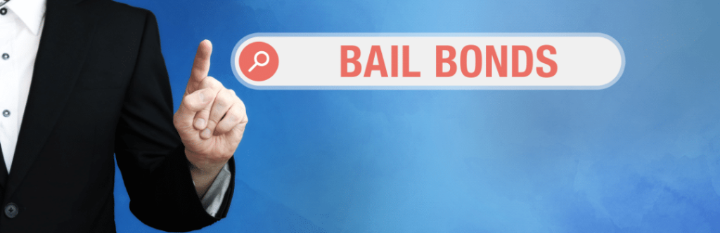man in suit pointing to internet browser search bar with bail bonds