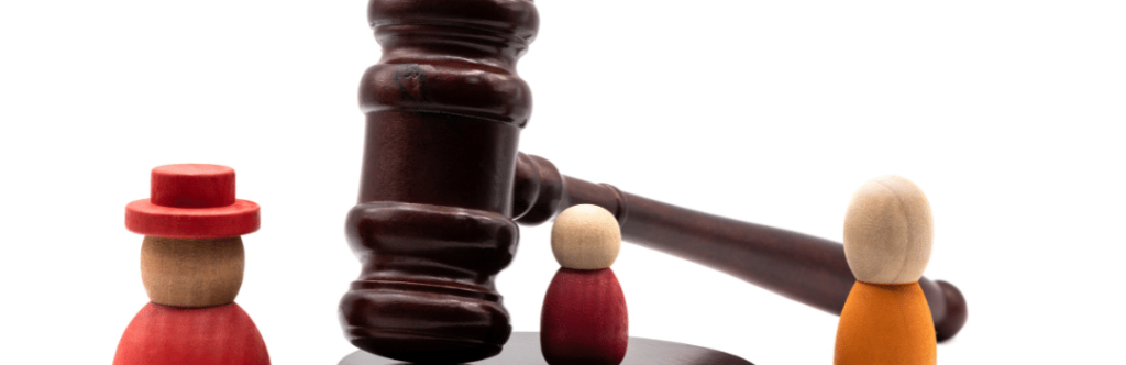 gavel with three wooden people figures representing bail bond agent and family