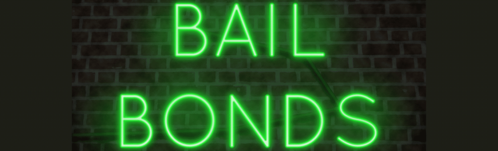 neon green words bail bonds on brick background